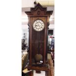 A 19th century mahogany Vienna style wall clock with pillasters to sides