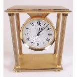 A Garrard and Co brass mantel clock with pillar design - boxed
