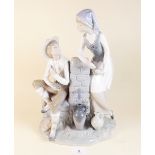 A large Lladro Nao group boy and girl at waterspout, 36cm