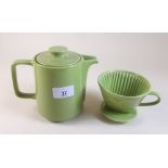 A retro green Melitta coffee pot and filter