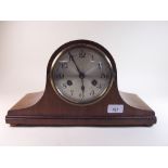 A 1930's arch top chiming mantel clock