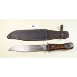 A Bowie knife in leather scabbard