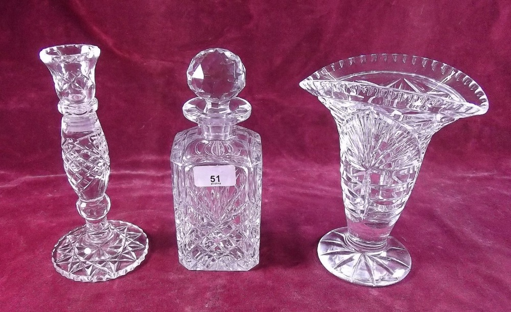 A cut glass decanter, vase, decanter and candlestick