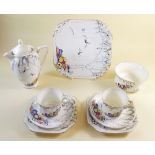 A Carlton Ware tea service decorated swallows and flowers comprising six cups and saucers, coffee