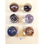 A collection of six Caithness glass paperweights: 'Pirouette', 'Helter Skelter', 'Persephone', '