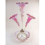 A Victorian cranberry and vaseline glass three flute epergne - 46cm