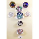 Eight Caithness glass paperweights: 'Glamis Rose', 'Time Tunnel', 'Tarantella', 'Pebble', 'Chorale',