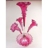 A Victorian large cranberry glass four flute epergne - 55cm tall