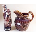A novelty dog musical pottery flask and large brown glazed jug