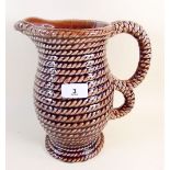 A pottery 'rope' jug - 9.5" tall