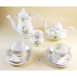 A Royal Grafton Evesham tea service to include:- twelve teacups and saucers, four milk jugs, three