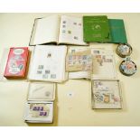 A plastic box containing five albums and loose stamps in tins, and a Stanley Gibbons catalogue for