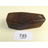A novelty wooden puzzle snuff box