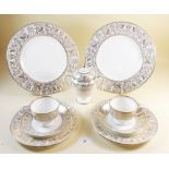 A Wedgwood Gold Florentine part tea service comprising:- six teacups and saucers, two cake plates,