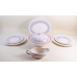 A Clarice Cliff pink and grey banded dinner service comprising two tureens, six dinner plates, six