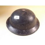 A WWII tin firemans helmet - re-painted