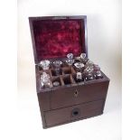 A Victorian mahogany apothecary box with fitted interior and contents and drawer under