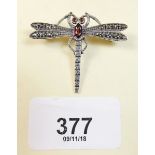 A silver marcasite dragonfly brooch