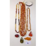A quantity of amber jewellery, brooches etc