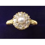 A gold, pearl and diamond cluster ring - size K - unmarked