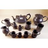 A collection of antique pewter measures, teapot , water jug etc