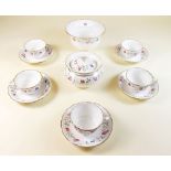 A Davenport Pearlware floral painted child's part tea service comprising three cups and saucers,