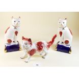 A pair of reproduction Staffordshire cat ornaments
