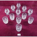A set of six cut glass brandy glasses and six cut glass tumblers