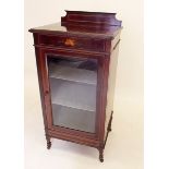 An Edwardian mahogany music cabinet with marquetry inlay of lute, pipes and tambourine