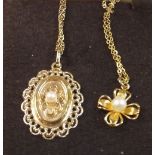 A 9 carat gold pendant of flower form and another 9 carat gold pendant - both set seed pearls