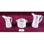A Royal Worcester group of two white leaf form jugs and sugar bowl