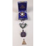 A Primrose League enamel badge, Kent County badge, Kings Own Borders silver and enamel badge and a 9