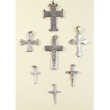 Seven silver crucifixes