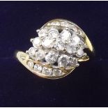 An 18 carat gold diamond set crossover panel ring - size L