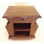 An Indian hardwood occasional table with magazine rack sides