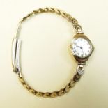 A Cara 9 carat gold ladies wrist watch on gold plated strap