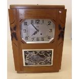 A French Art Deco wall clock with striking movement