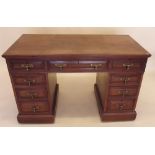 An Edwardian mahogany twin pedestal desk