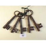 Five various large antique keys