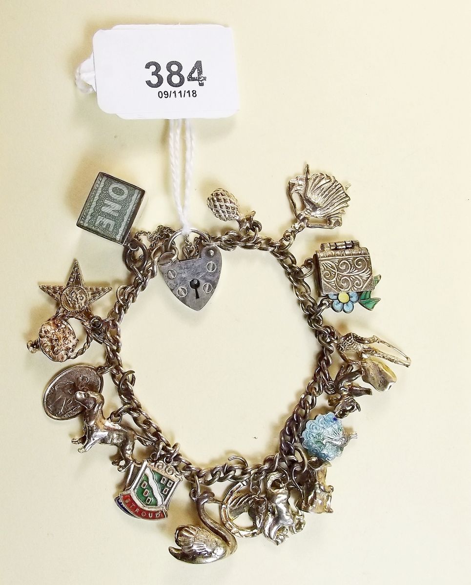 A silver charm bracelet - total weight 46g