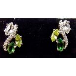 A pair of 18 carat white gold stud earrings set citrine, peridot, green tourmaline and chip