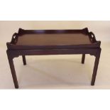 A 20th century mahogany butlers tray top coffee table