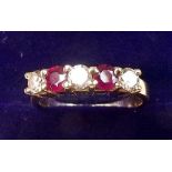 An 18 carat gold ring set rubies and diamonds, size N