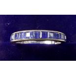 An 18 carat white gold ring line set sapphires, size N