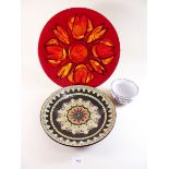 A Poole Aegean charger, a Poole floral bowl and a pottery plate