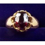 A 9 carat gold ring set garnet - size 0