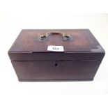 A Georgian mahogany tea caddy with brass handle and interior liner