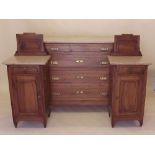A late 19th century continental walnut chest of four drawers with marble top and two matching