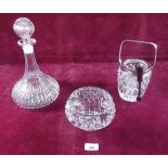 A cut glass decanter, rose bowl and ice bucket with tongs