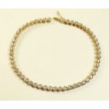 A 9 carat gold diamond set tennis bracelet